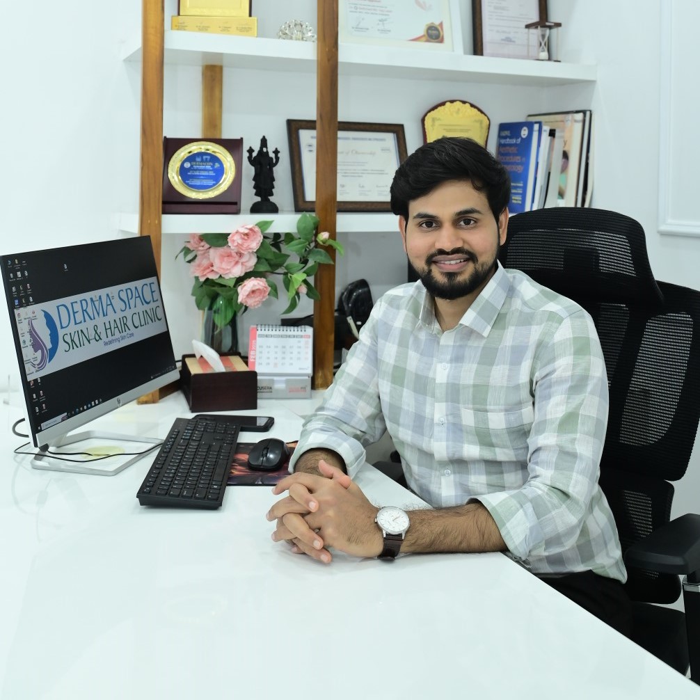 Dr. Brahma Upputuri sitting in clinic